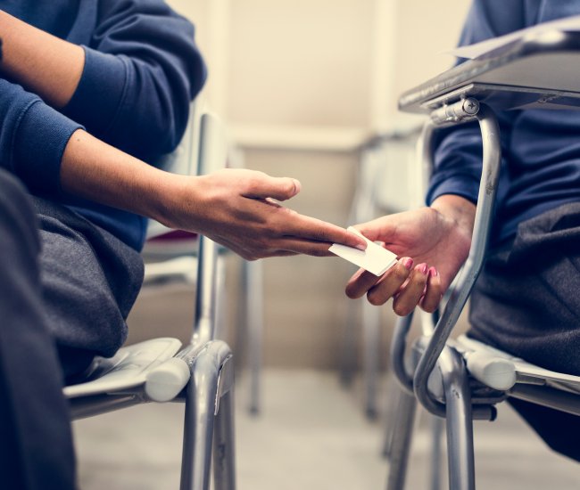 young-students-cheating-on-an-exam-2025-02-10-04-53-55-utc